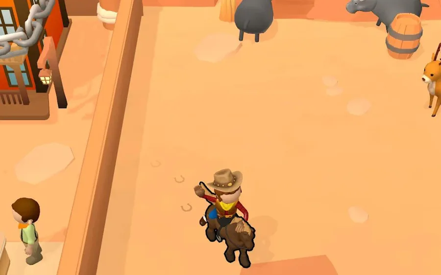 Ranch Cowboy screenshot: a cowboy rides his horse across the ranch yard past penned cattle and a barrel, with red canyon rock and a wooden storefront behind him