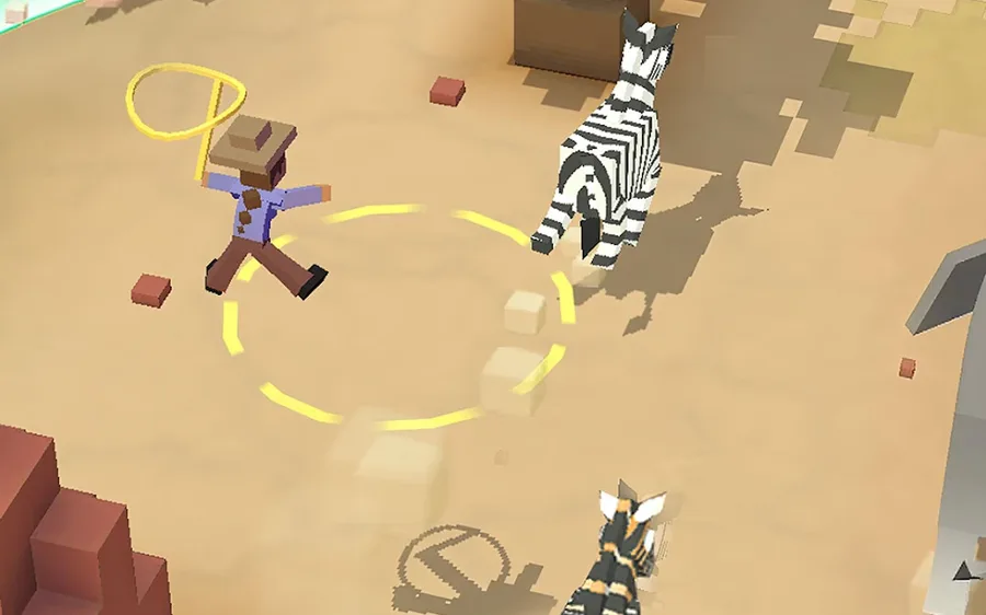 Rodeo Stampede: Sky Zoo Safari screenshot: a cowboy swings his lasso at a zebra on the sand between blocky red canyon rocks